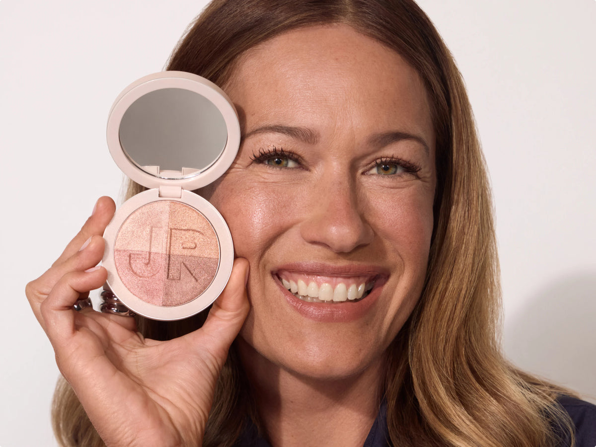 Model holding the open Silky Highlighting Powder compact