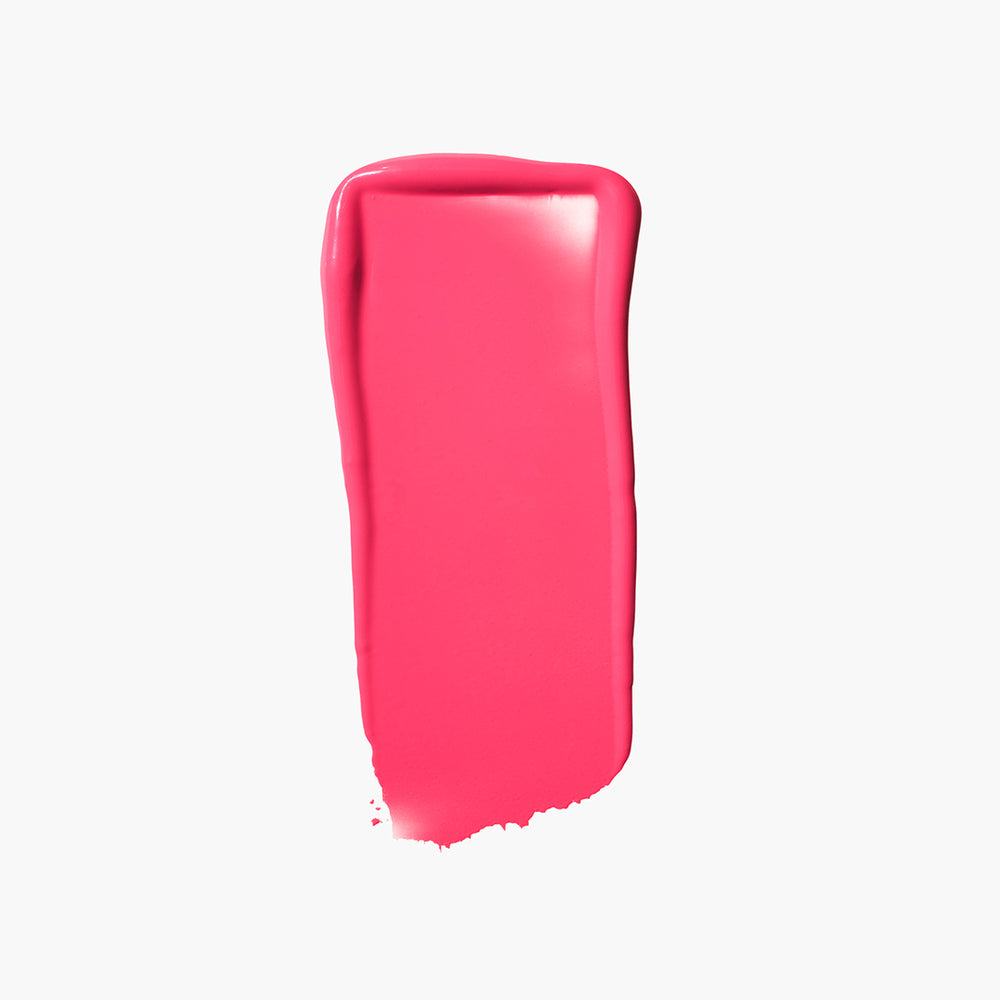 A swatch of Jones Road Beauty's Lip And Cheek Stick in the shade Bright Pink