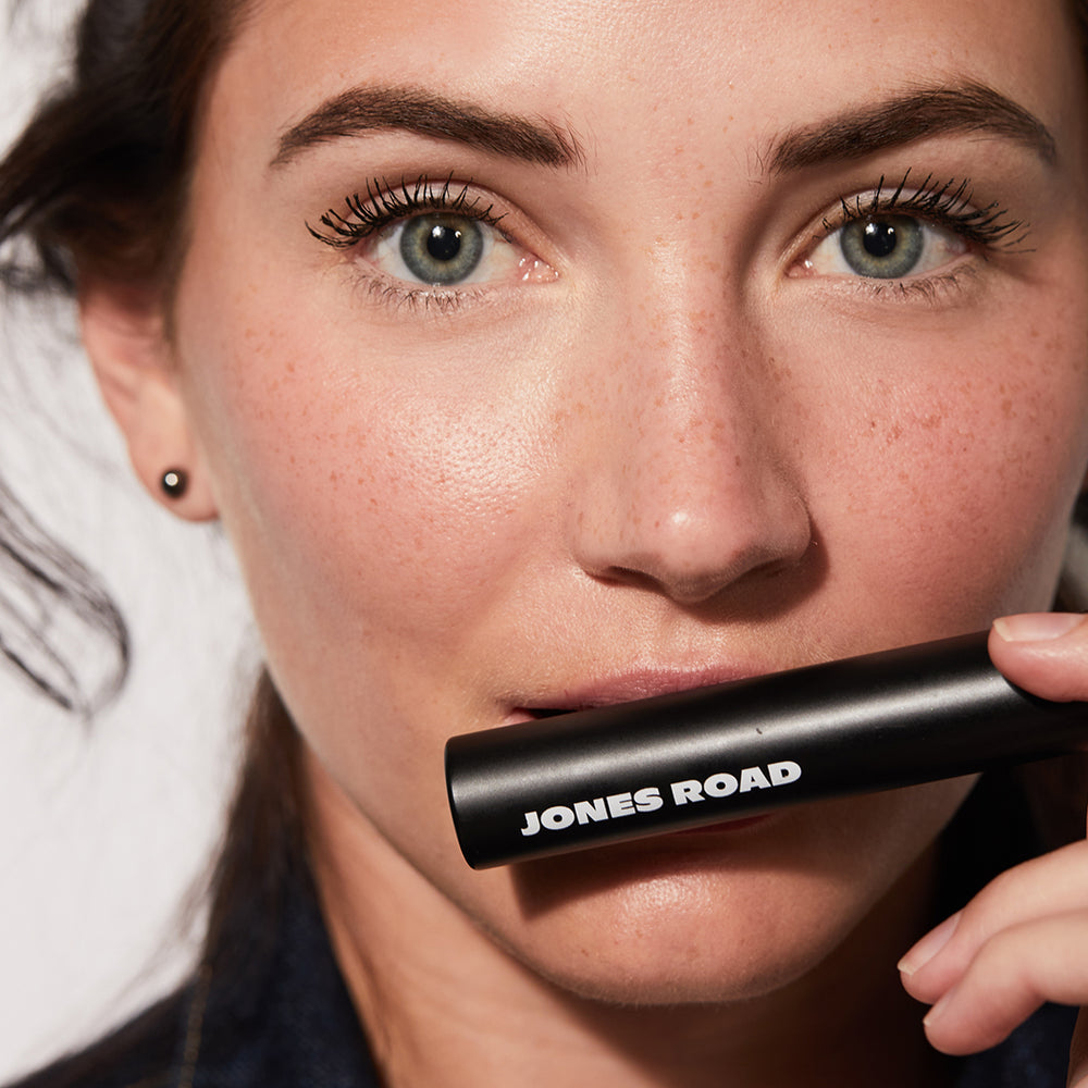 A woman holding The Mascara by Jones Road